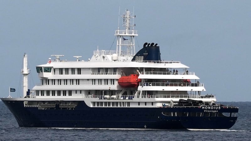 The MV Hondius cruise ship departs the port in Praia, Cape Verde, Wednesday, May 6, 2026.
