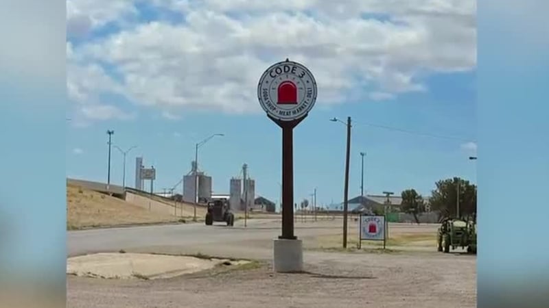 An old gas station sign now stands as a landmark representing the lives of three first...