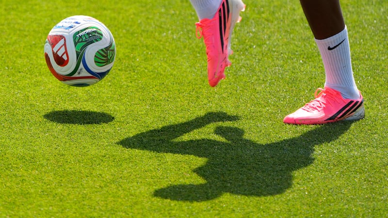 A Netherlands national team player practices for the World Cup soccer tournament, Wednesday,...