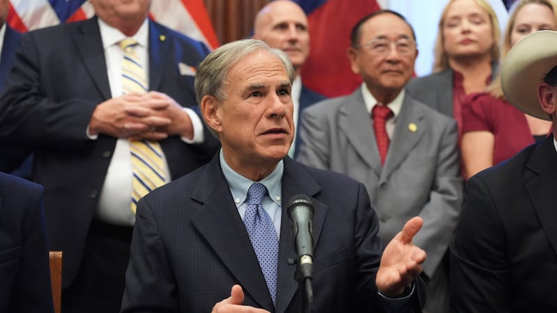 Texas Gov. Greg Abbott speaks to the media following a bill signing as Texas senators debate a...