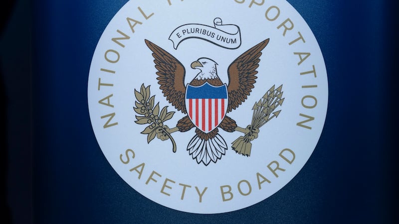 The seal of the National Transportation Safety Board is seen before a news conference at...