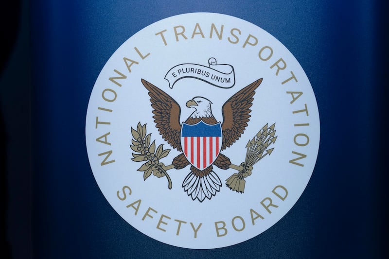 The seal of the National Transportation Safety Board is seen before a news conference at...