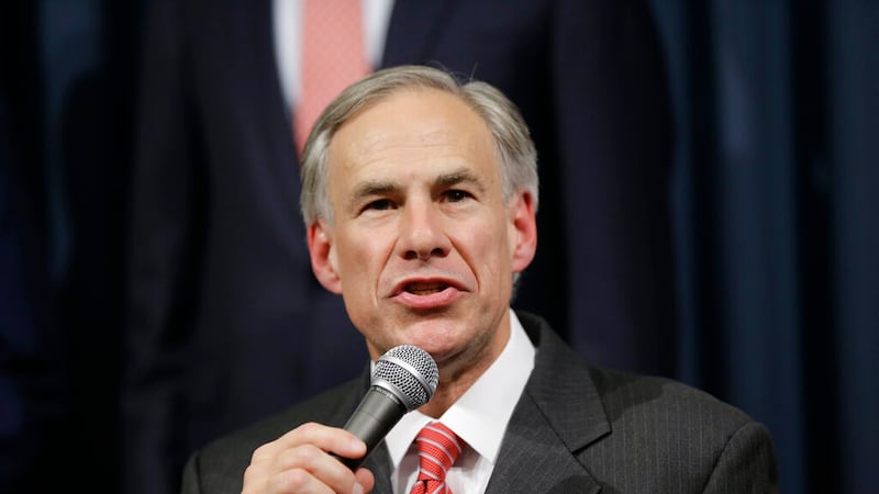 Texas Attorney General Greg Abbott speaks during a news conference with Gov. Rick Perry in the...