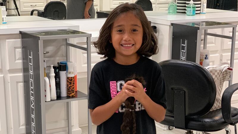 Six year old donates hair to children with hair loss.