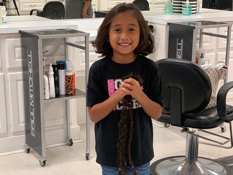 Six year old donates hair to children with hair loss.