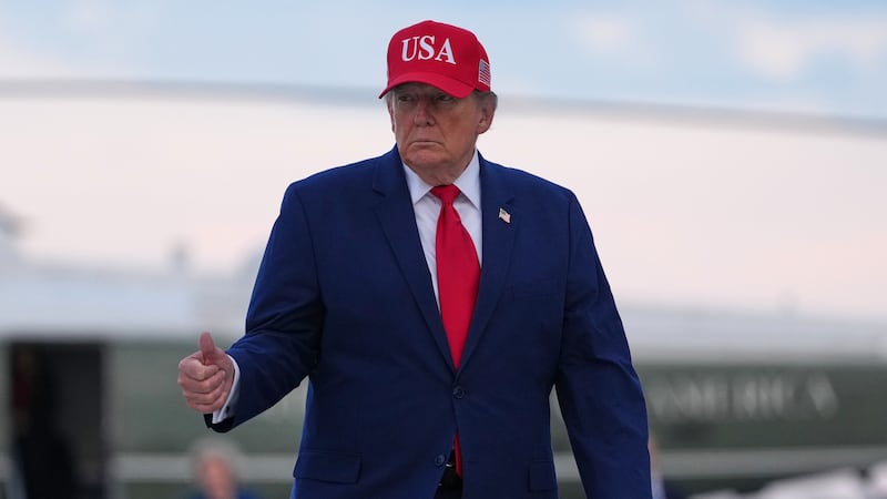 President Donald Trump walks from Marine One to board Air Force One, Friday, Oct. 16, 2026, at...