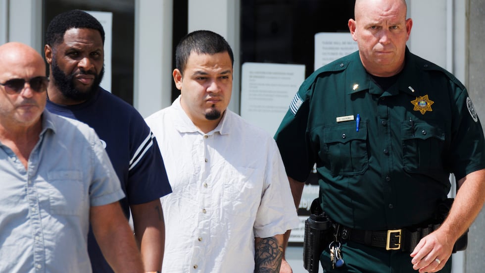 Kilmar Abrego Garcia , second right, leaves the Putnam County Jail, Friday, Aug. 22, 2025, in...